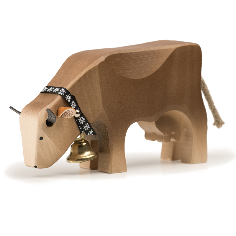 Cow eating brown Swiss wooden animal