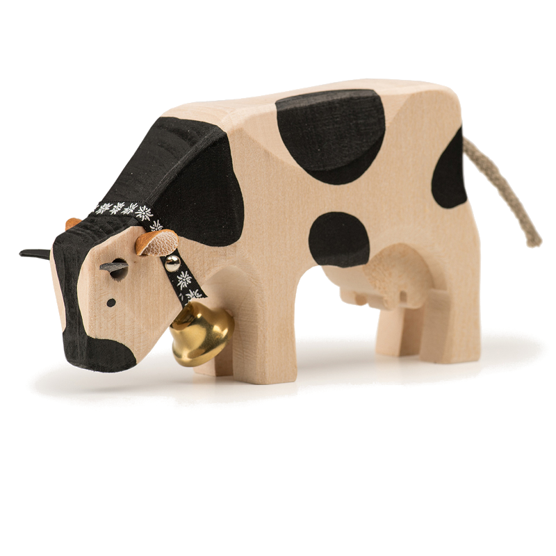 Mucca che mangia un animale di legno di Friburgo