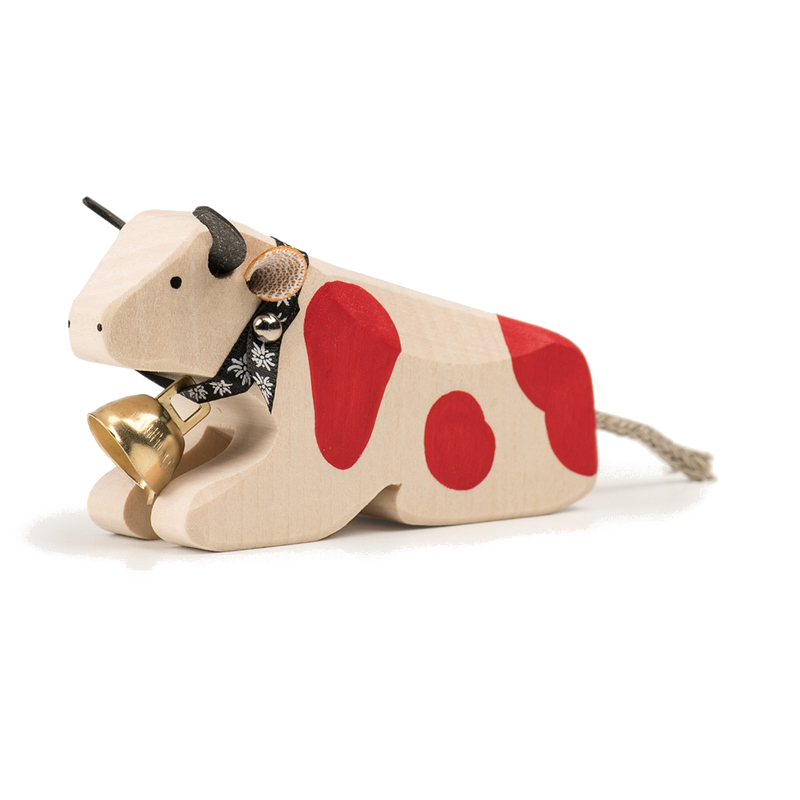 Mucca sdraiata animale di legno rosso